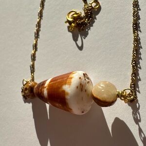 Handcrafted adjustable gold cone shell necklace with tigers eye beads